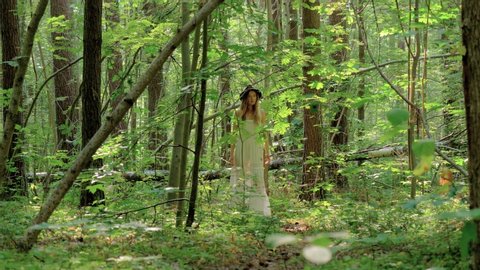 Young caucasian woman wandering around in the forest