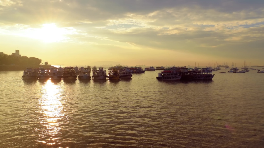 Boats on Mumbai water at dawn. Colaba region of Mumbai, Maharashtra, India.