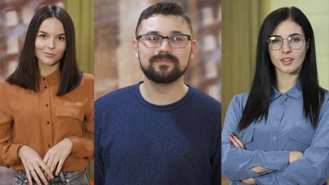 portraits of three young smiling workers guy and girls posing in modern comfortable coworking office slow motion