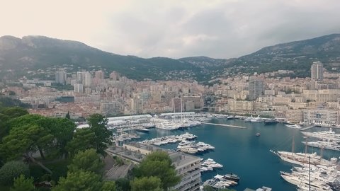 Aerial panoramic view of cityscape of Monte Carlo, yachts in harbour, landscape panorama of Monaco from above, Europe