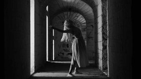  Dancing blonde woman in  dress in an old abandoned building Black and white video. Contact improvisation, contemporary
