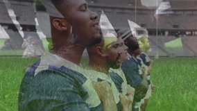 line of rugby players singing a national anthem before match at a stadium, with a close up of rugby ball being thrown into a scrum in the foreground - Powered by Shutterstock - Get 15% off with code: PIKWIZARD15