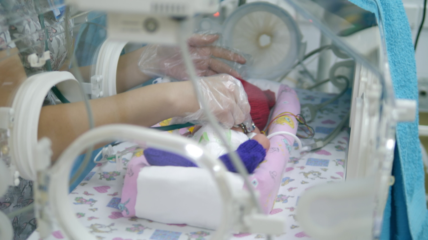 Nurse listens to newborn baby heart. Royalty-Free Stock Footage #1041861343