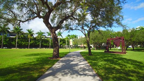MIAMI, FL, USA - NOVEMBER 24, 2019: Biking on a college campus 4k fpv footage