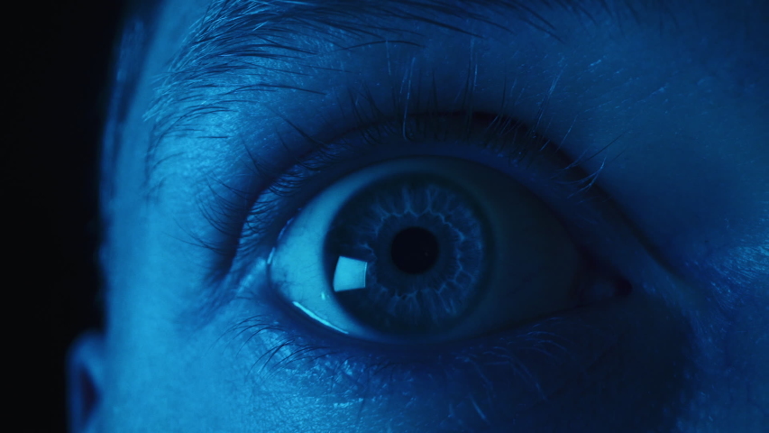 Close up macro shot of eye opening, with colored lights | Shutterstock HD Video #1041876793