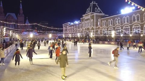 Moscow, Russia - January, 2019: People skate on the rink on the main square of Russia. The annual ice rink on Red Square. Full-screen shot of the general plan of the rink.