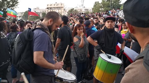 Santiago de Chile
Chile
22/11/2019
Some musicians amusing protesters with some music during latest November Chile riots and protests. These are the protesters faces at Santiago de Chile streets riots