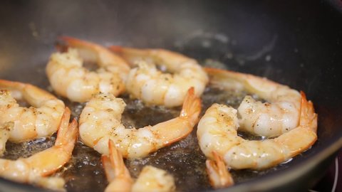 Close-up of shrimps being fried in oil pan