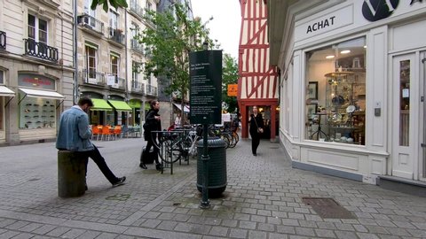 Rennes, Brittany, France - June 19, 2019: Hyper lapse along busy street of shops, cafes and restaurants Rue Vasselot in Rennes