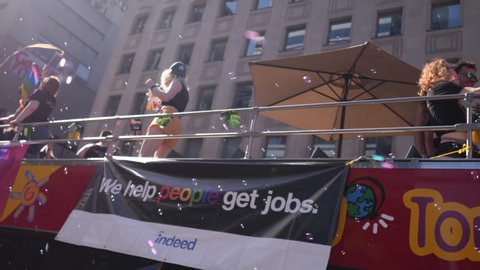 TORONTO, CANADA JUNE 23RD, 2019: Happy Protesters Dancing & Celebrating Gay Pride on  Bus With Flags & Bubbles