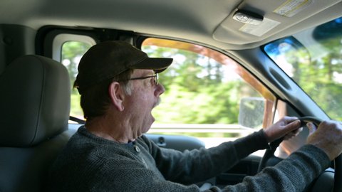 Man yawning while driving truck on highway