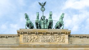 Berlin Brandenburg Gate Statue on top, On top of Brandenburger Gate, a statue named 'Quadriga' was placed. It depicted the goddess of victory on a chariot pulled by four horses. Time lapse video.