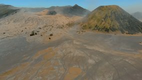 Aerial view on famous active Bromo volcano or Mount Gunung Bromo and Batok volcano inside the Tengger caldera on the Java island