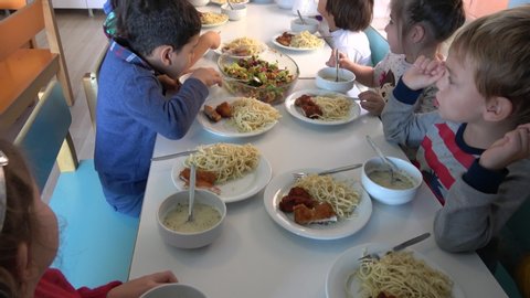 Fethiye, Turkey - 27th of November 2019: 4K At the Istanbul Development nursery school - Viewing table and children having their set meal 
