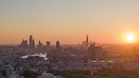 London, United Kingdom 10.10.2019: Aerial Drone Helicopter Panoramic View Of London Eye City Of London Skyline The Shard Sky Garden And Thames River Hyperlapse Time Lapse At Sunrise Morning Mist