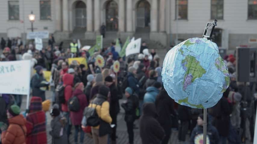 A blow-up globe being held at a climate protest. Royalty-Free Stock Footage #1041966448