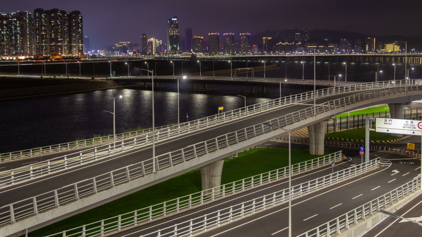 Macau traffic cityscape night timelapse pan up