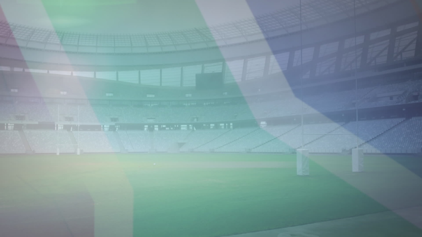 Animation of rugby ball with South African flag and the words South Africa in front of rugby stadium
