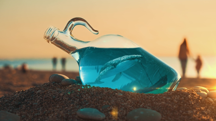 Whale In A Bottle With A Blue Sea And A Sunken Ship At The Bottom. Amazing Find On The Beach. Fantastic Picture Of The Deep Sea. Mother And Baby Are Walking On The Beach At Sunset On the Background