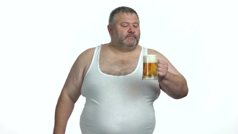 Overweight man with glass of beer on white background. Fat guy drinking alcohol. Unhealthy way of life.