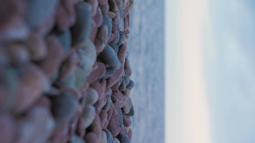 beach, pebbles, stones closeup, autumn, winter. vertical video footage