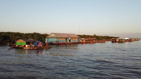 The Floating Village of Kampong Khleang on Tonle Sap Lake at Siem Reap Cambodia During Sunset