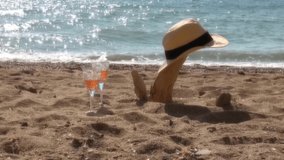 blurred soft focus romantic video. lovers man and woman are walking near the sea on the beach. feet sand. newlyweds. husband and wife love story. champagne glasses
