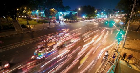 Stock 4k: Time lapse or timelapse view of Ho Chi Minh City or Saigon, Vietnam. Night time lapse footage view of traffic in city, landmark buildings and traffic in the financial district at night