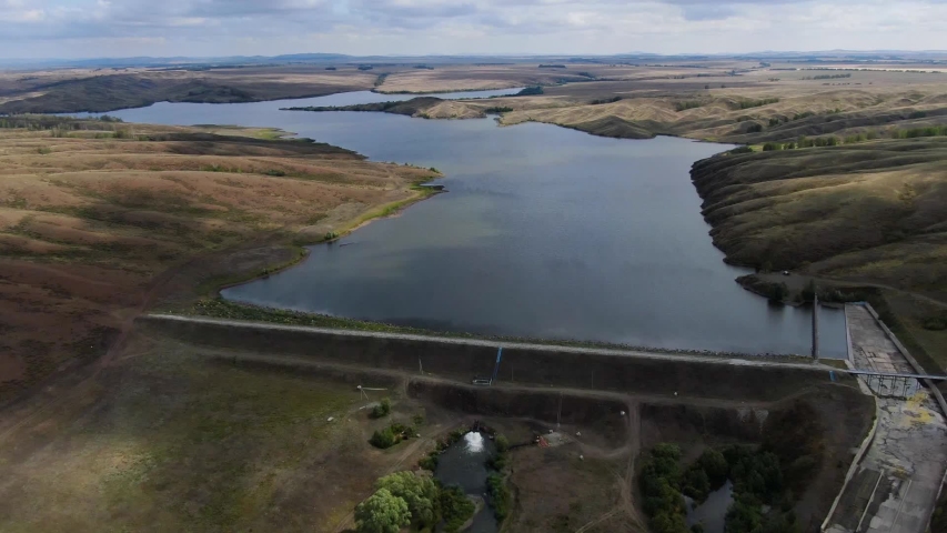 Large tank, dam, water intake. View from above