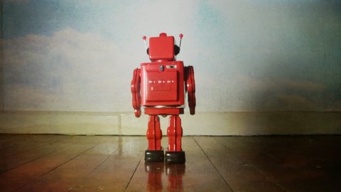 red retro robot attack with dark sky background