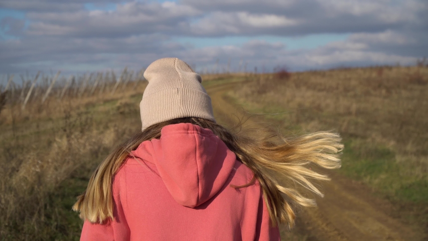 The girl goes and puts a hood on her head. It