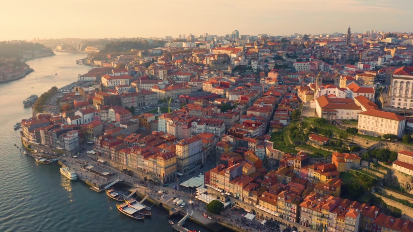 Porto, Portugal. Aerial view of the old city with promenade of the Douro river at sunset Royalty-Free Stock Footage #1042079779