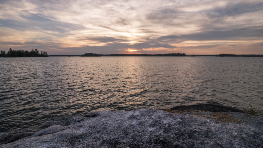 A sunset time lapse taken from a small rocky island on Eagle Lake located in Northwest Ontario, Canada.