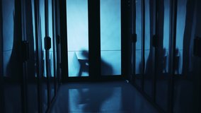 Walkthrough of data center digital room. Behind door anonymous hacker using laptop managing database server cabinet trying to steal information. Cybercrime. - Powered by Shutterstock - Get 15% off with code: PIKWIZARD15