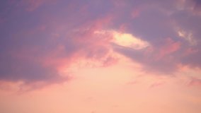 TimeLapse. 4K. Dramatic sunset. Fast moving purple, pink, red, orange, blue clouds in the sky. Natural colors. Evening sky. Time Lapse Ultra HD stock footage - Powered by Shutterstock - Get 15% off with code: PIKWIZARD15