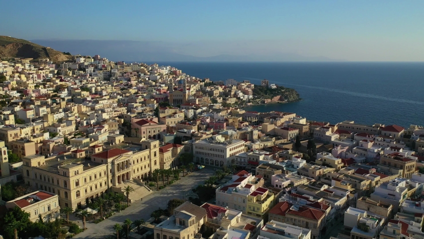 Aerial drone video of iconic landmark neoclassical city hall building in main town of Syros or Siros island - Miaouli square, Ermoupolis, Cyclades, Greece
