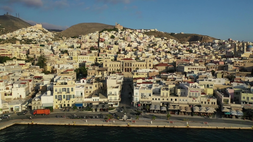 Aerial drone video of iconic landmark neoclassical city hall building in main town of Syros or Siros island - Miaouli square, Ermoupolis, Cyclades, Greece