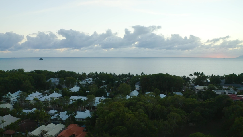 Aerial view on little suburban town Palm Cove and the ocean, early in the morning on sunrise in Cairns, Queensland, Australia