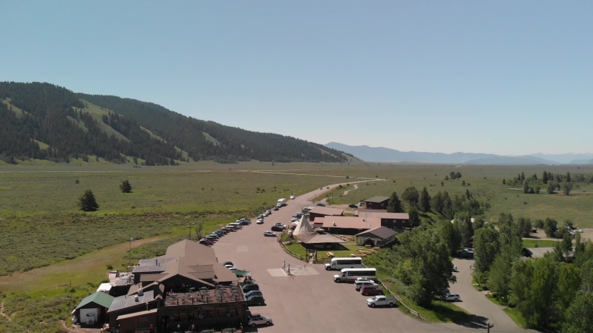 Panoramic aerial view of Grand Teton peaks, landscape and Snake River on a beautiful summer day, Wyoming - USA.