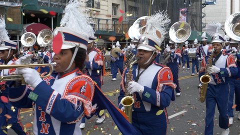 New York City, NY - November 28, 2019: Morgan State University Marching Band in the Macy's Thanksgiving Day Parade with throngs of spectators all over.