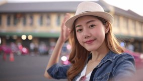 Traveler Asian blogger women travel in Bangkok, Thailand, beautiful female using mobile phone make vlog and live in social media .woman tourist making video call with smartphone while traveling .