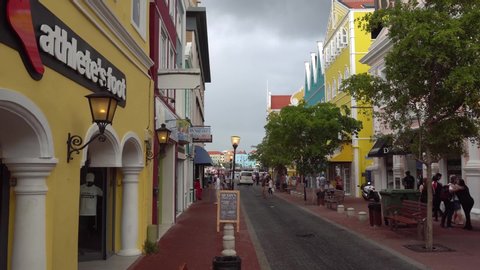 Willemstad, Curacao / Dutch Antilles -  November 18th 2019: Tourists walking on the main street on cloudy afternoon