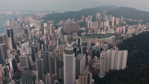 HONG KONG, CHINA - MARCH 2019: Overhead aerial shot of Hong Kong urban dense development on the hills. Famous landmark buildings.