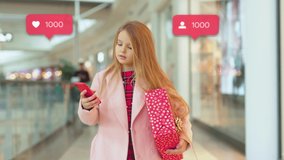 Portrait smiling child girl walk in shopping mall with Christmas present boxes use phone social media icons like comment follower counter quick increase blogger new year holiday childhood slow motion