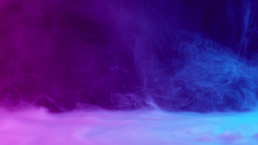 Slow motion of coloured smoke effect with neon lights Royalty-Free Stock Footage #1042121401