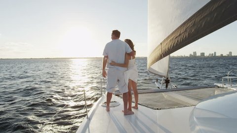 Young Caucasian Male Female Couple Holiday Insurance Yacht Casual Sailing