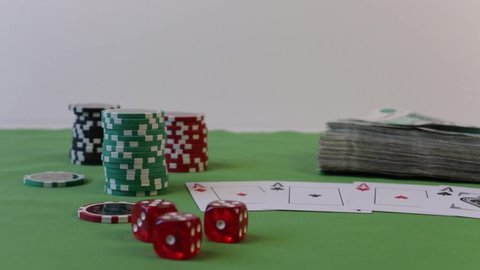 Krasnodar,Russia-12/02/2019: Cards and chips on a green casino table. Combination of 4 aces or square poker background with a copy of .russian cash rubles 1000 large Theme of gambling, poker, casino a