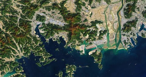 Very high-altitude overflight aerial of islands and bays along the Southern coast of South Korea. Clip loops and is reversible. Elements of this image furnished by NASA