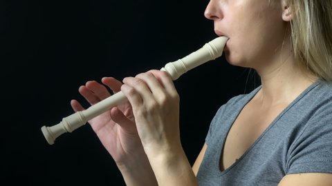 Flute music playing flutist musician performer with bright musical instrument