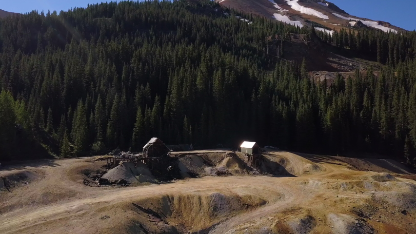 Scenic Colorado aerial establishing shot of old mining operation in the Red Mountain Mining District.